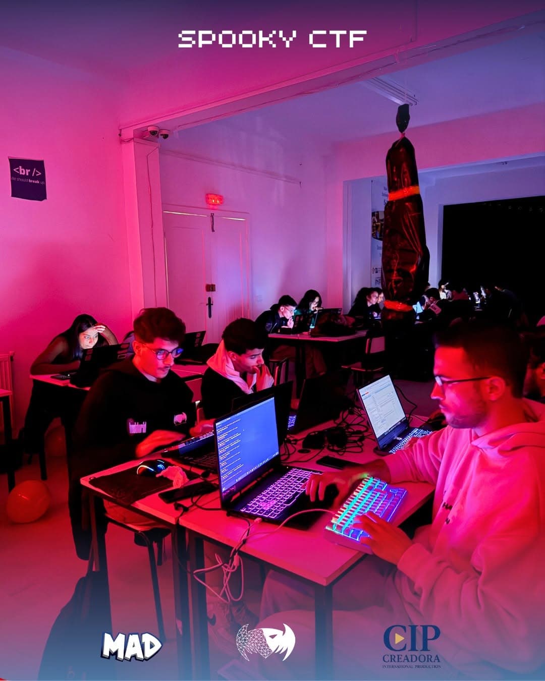 Players at their laptops during a night CTF
